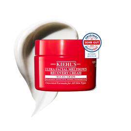 Roter Tiegel der Kiehl’s Ultra Facial Meltdown Recovery Cream Whip mit einer aufgeschlagenen Cremetextur.