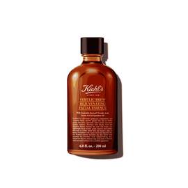 A graphic featuring a dark amber bottle of Kiehl's Ferulic Brew Facial Essence with a black cap. The label has white and yellow text that reads “100 ml". 