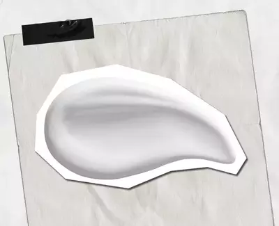 A smooth, glossy, white cream or lotion in the shape of a teardrop on a white background.