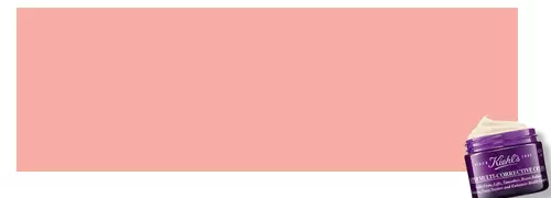 Alt-Text: Eine lila Creme-Dose von Kiehl's auf einem sanften rosa Hintergrund.