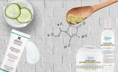 Hautpflegeprodukte von Kiehl's auf einem hellen Hintergrund mit Gurkenscheiben und chemischer Struktur.