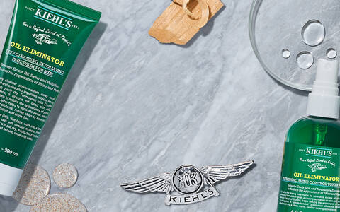 Banner mit Oil Eliminator Produkten im Hintergrund