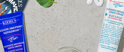 Banner mit Kaffeebohnen, Deko und unterschiedlichen Kiehls Produkten im Hintergrund