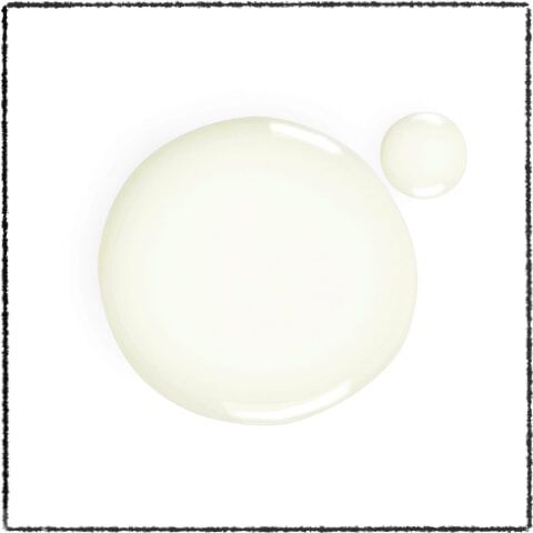 Two translucent droplets of a pale liquid against a white background. The larger droplet is circular, while the smaller one is round and sits beside it.