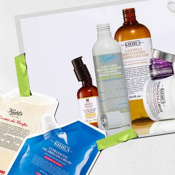 Eine Kollektion von Kiehl's Hautpflegeprodukten, darunter Lotionen und Seren, kunstvoll arrangiert mit leuchtenden Verpackungen und sichtbaren Etiketten.